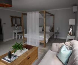 Ryefield Suite - luxurious guest room with four-poster bed and sumptuous bathroom