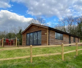 Log Cabin with View of the Malvern Hills